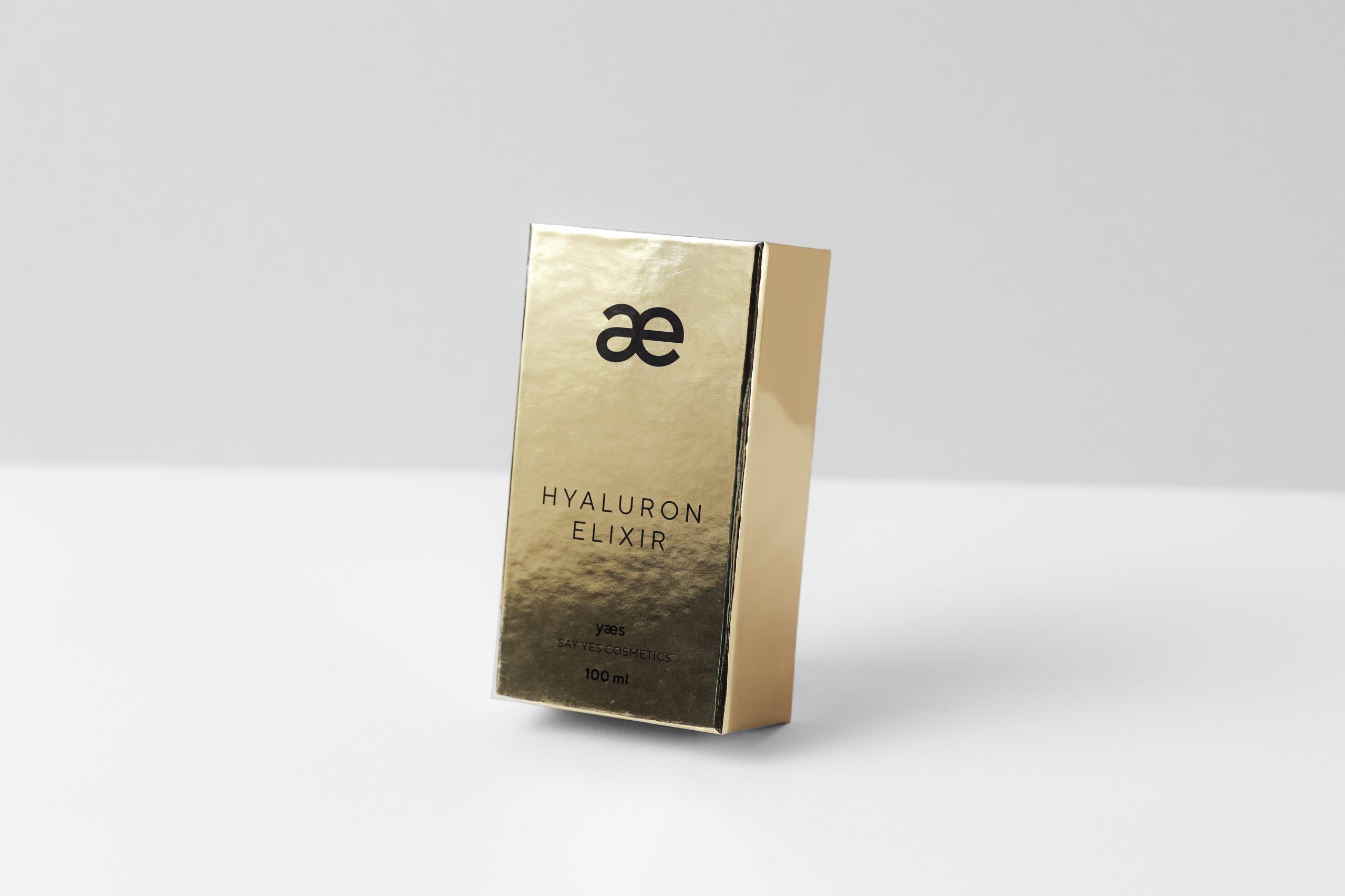 goldene schachtel mit ae logo für hyaluron elixir verpackung bedrucken und mit goldfolie von achilles